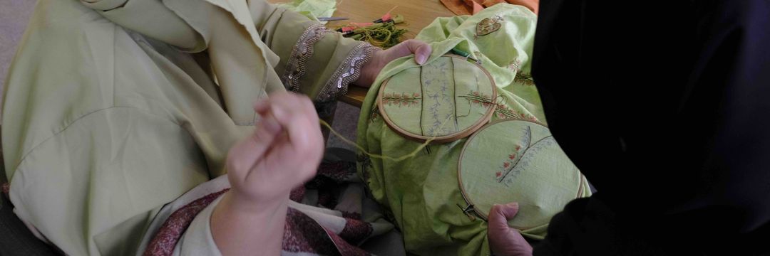 Embroidered abstract maps by immigrant women in Lisbon